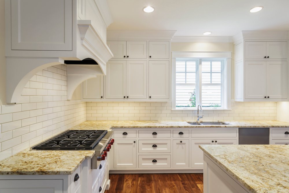 Bright white counters and cabinets in a luxury kitchen